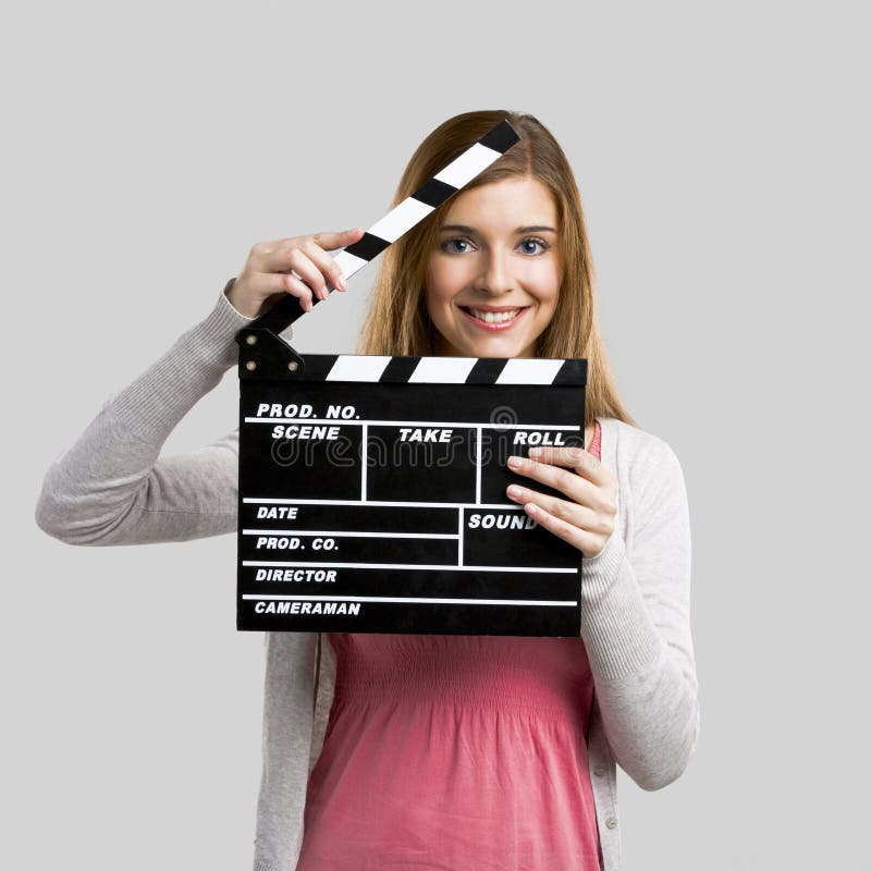 Beautiful girl holding clapboard royalty free stock photo Beautiful girl holding clapboard royalty free stock photo