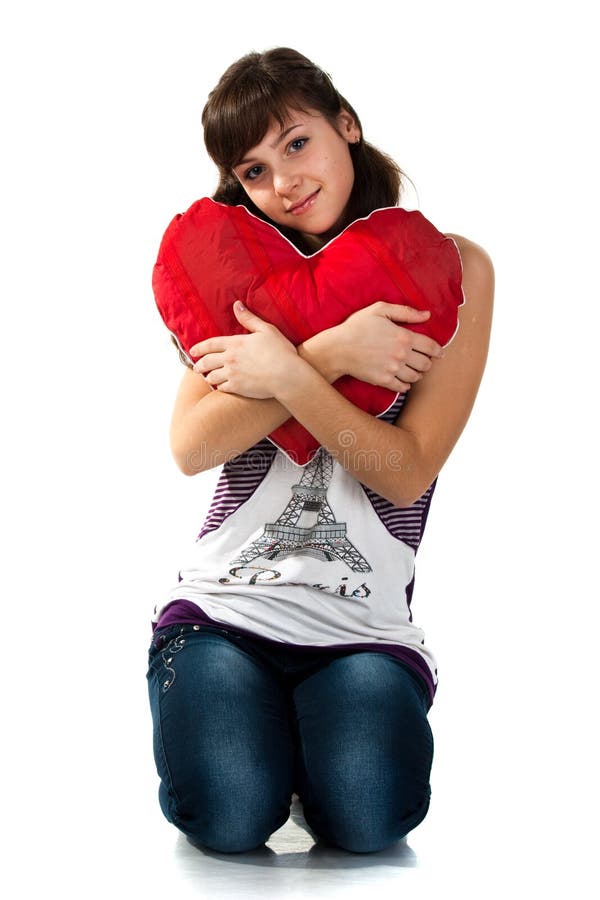 Beautiful girl holding a red heart