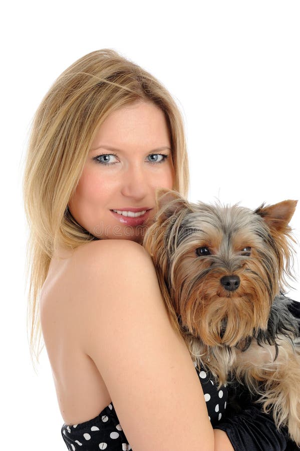 Beautiful girl holding small cute york terrier dog