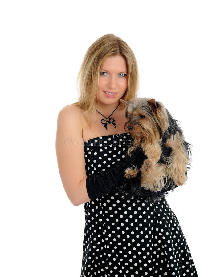 Beautiful girl holding small cute york terrier dog