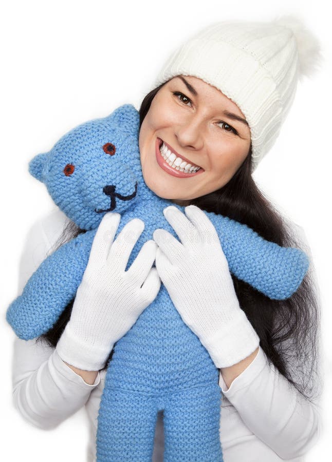 Beautiful girl is holding the teddy bear