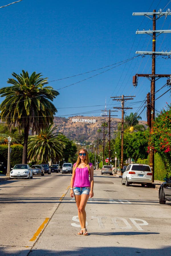 Beautiful girl at the Hollywood district near the Hollywood sign