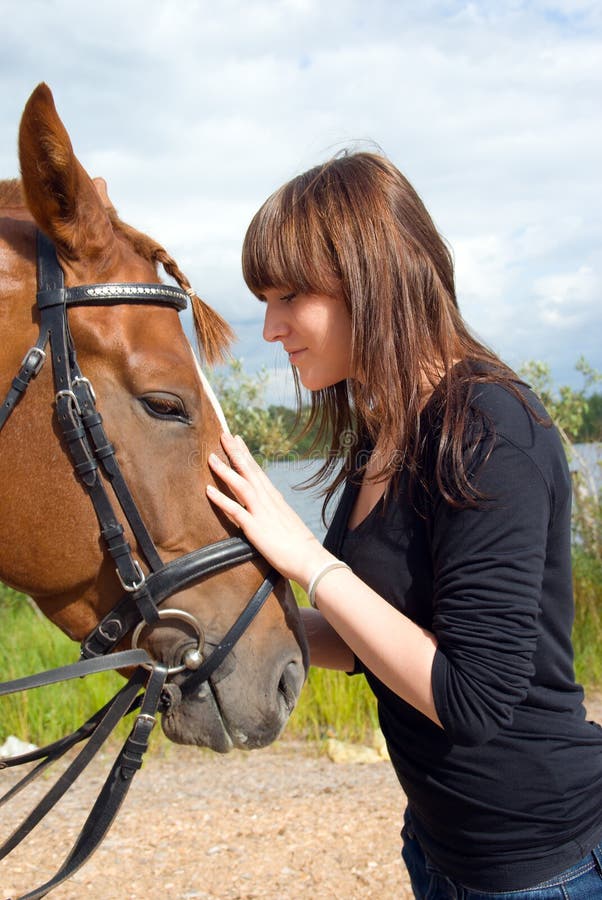 Beautiful girl and horse. stock photos