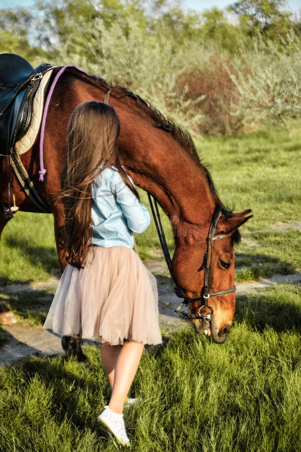 Beautiful Girl with Horse on the Grass. Stock Photo - Image of ...