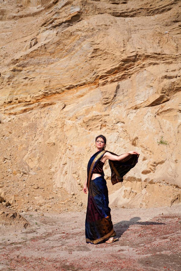 Beautiful girl in indian style against sand background