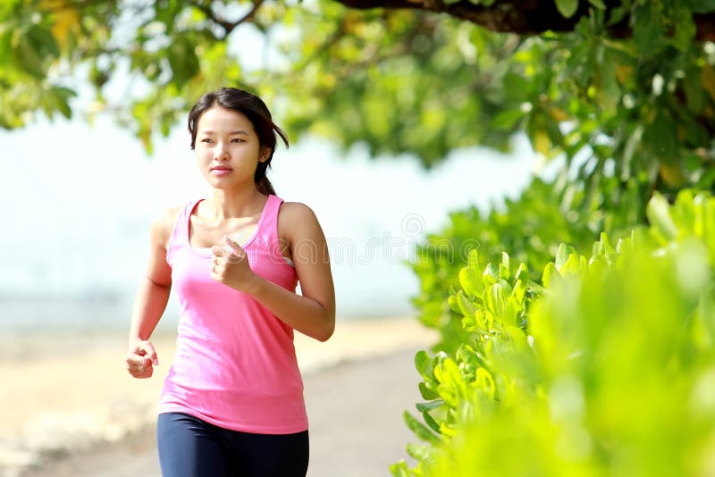 Beautiful girl jogging on the beach