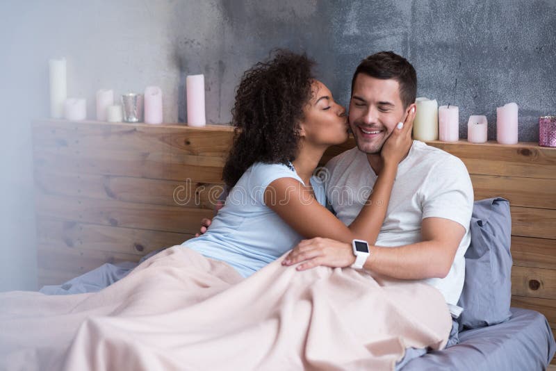 Beautiful Girl Kissing Her Boyfriend In Bed Stock Photo Image Of Girl