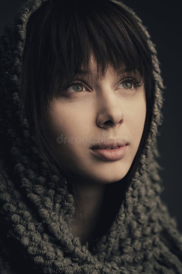 Beautiful girl with knitted scarf