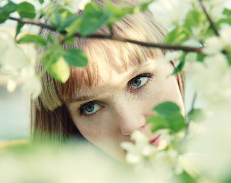 Beautiful girl among leaves