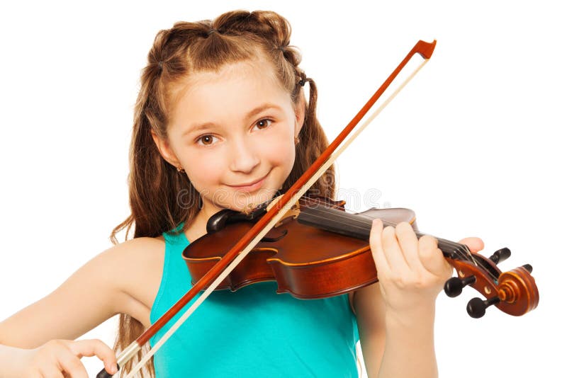 Beautiful girl with long hair playing on violin