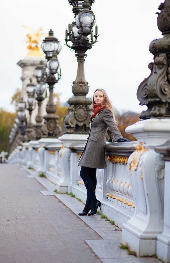 Beautiful girl with long hair on the Pont Alexandre III