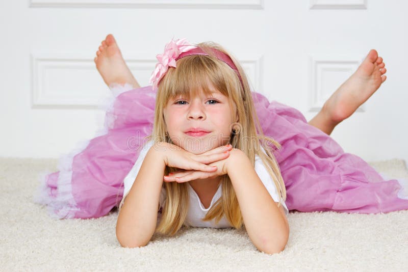 Beautiful girl lying on floor royalty free stock images Beautiful girl lying on floor royalty free stock images