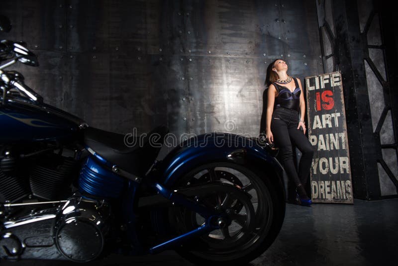 Beautiful girl and a motorcycle