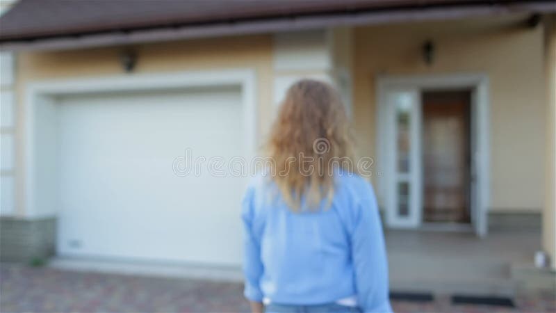 Beautiful girl next to her house