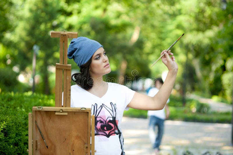 Painter Posing Next To A Canvas And Contemplating Stock Image - Image