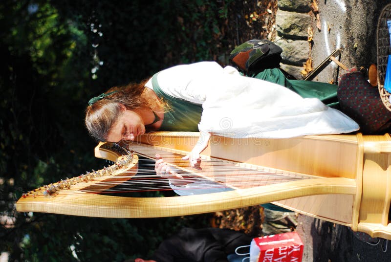 Beautiful Girl Playing Harp Editorial Stock Photo - Image: 12182998
