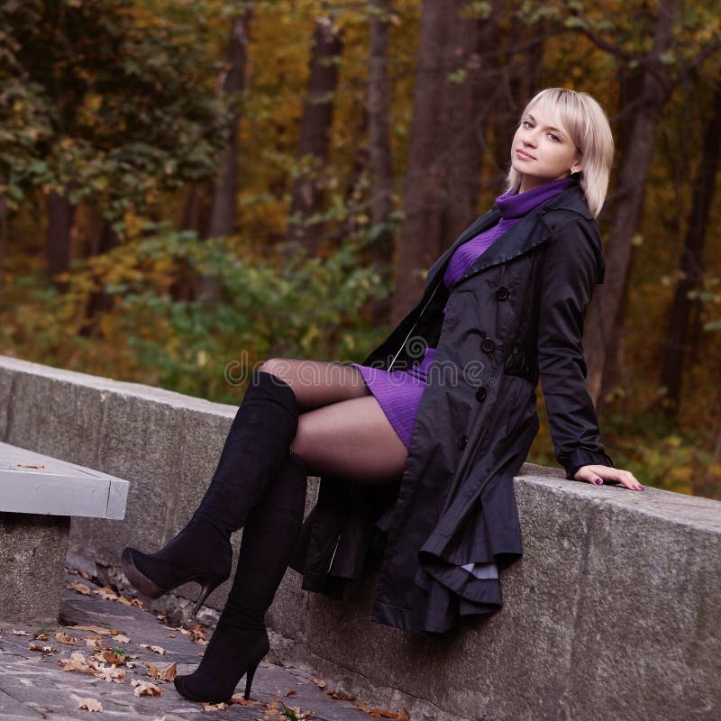 Beautiful girl posing in autumn park