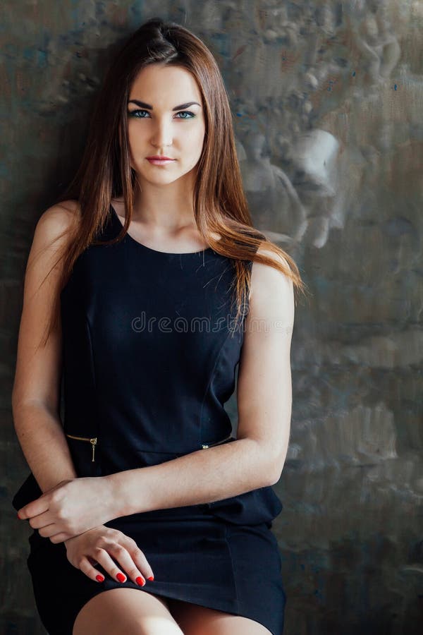 Beautiful Girl Posing in the Studio and Looking at the Camera Stock