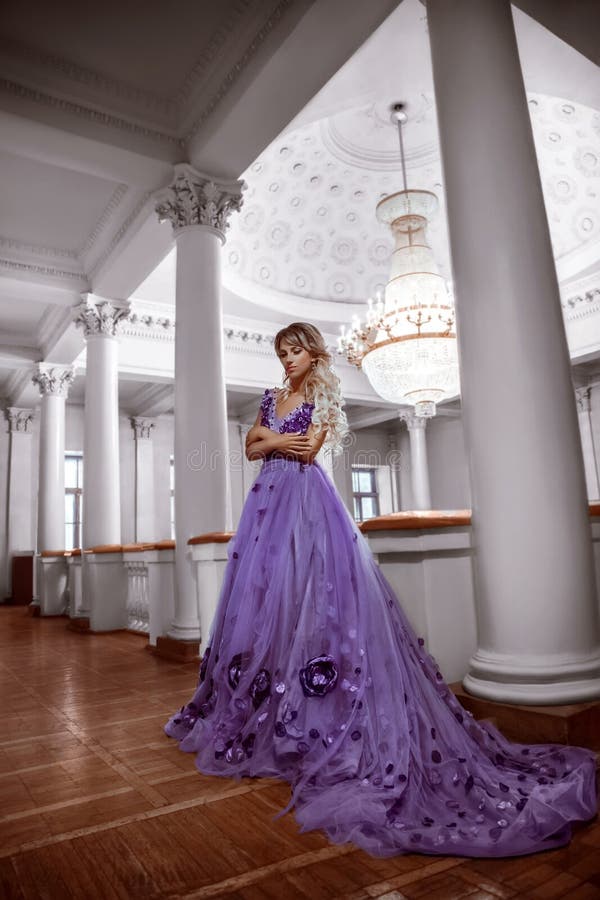 Beautiful girl in a purple dress stock image Beautiful girl in a purple dress stock image