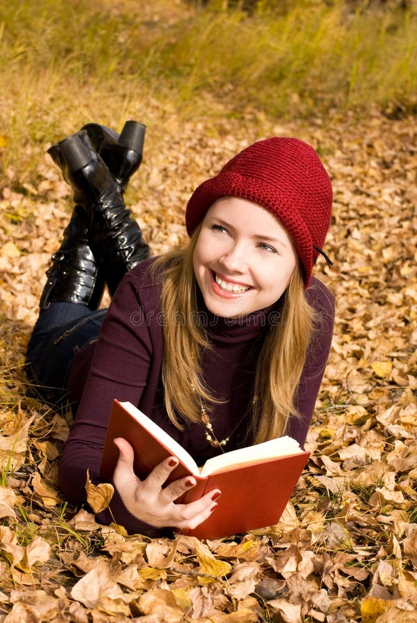 Beautiful girl reading a book