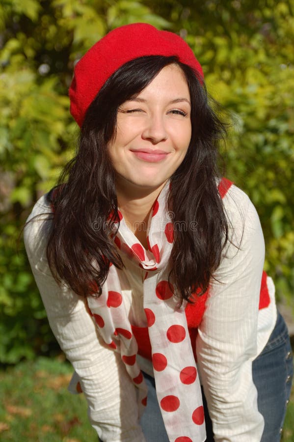 Beautiful girl in red beret smiling