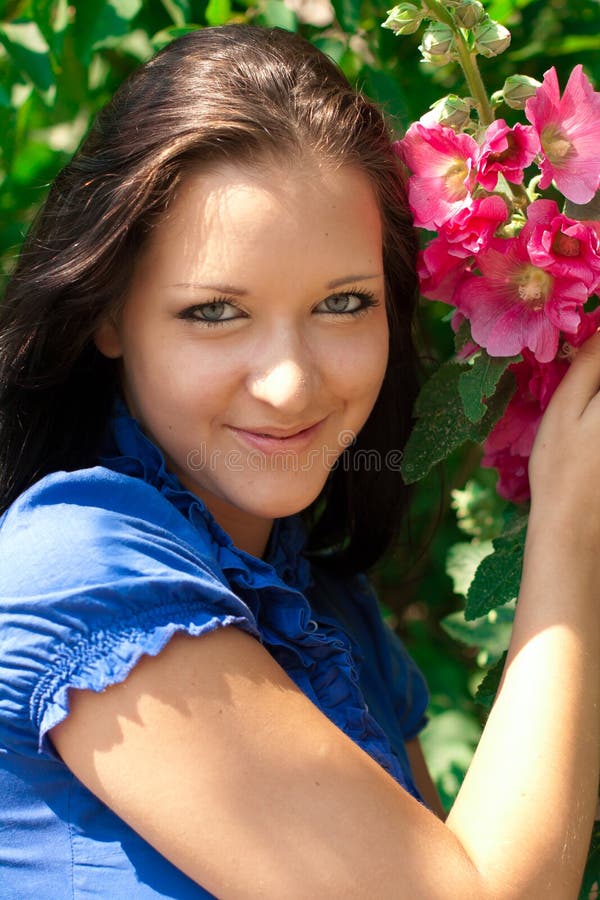 Beautiful girl with red flower