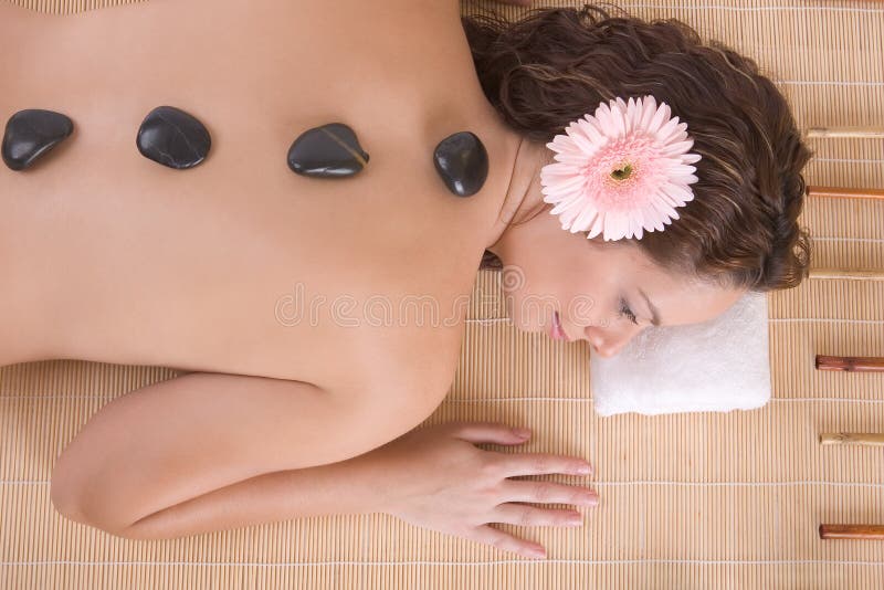 Beautiful girl relaxing on massage table