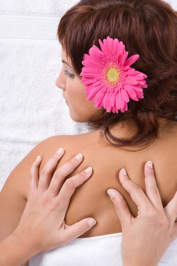 Beautiful girl relaxing on massage table