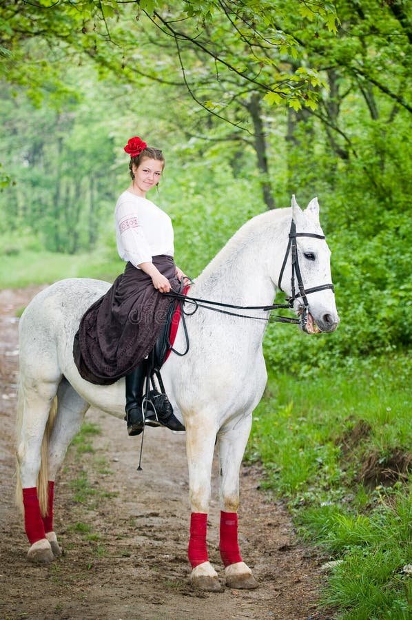 Beautiful girl riding horse