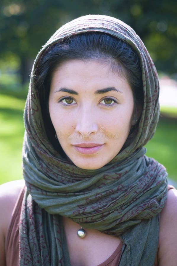 Beautiful girl with scarf safi on the lawn