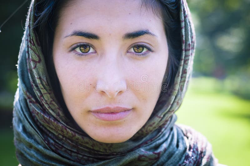 Beautiful girl with scarf safi on the lawn