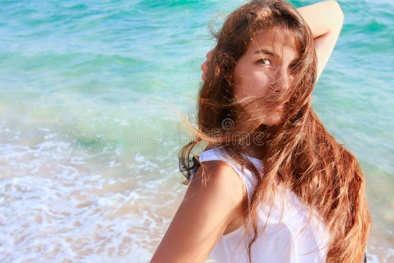 Beautiful girl on sea background