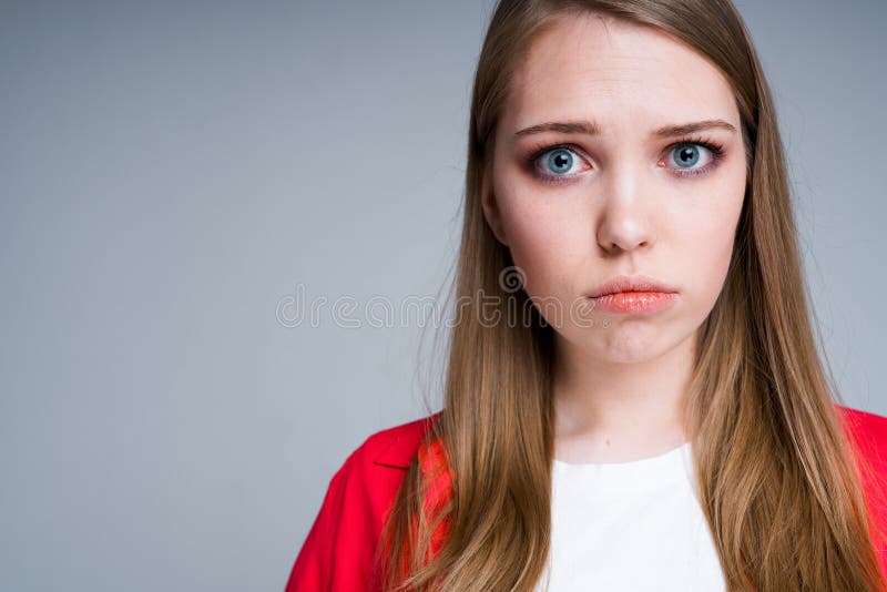 Beautiful Girl Showing Sad Face Pouting Lips while Standing on Gray  Background Stock Image - Image of looking, pensive: 219653231