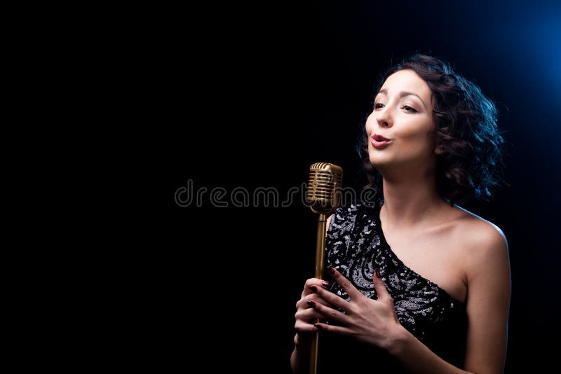 Beautiful girl singer singing emotional song with retro micropho royalty free stock images Beautiful girl singer singing emotional song with retro micropho royalty free stock images