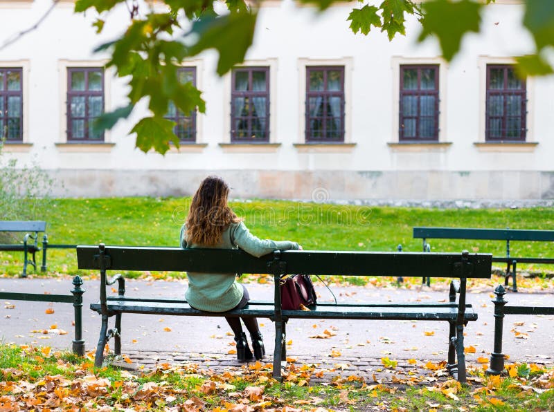 Beautiful Girl Sitting on a Bench, Sunny Autumn Day in the Park, Relaxing,  after Work Business Woman, Back View Stock Photo - Image of calm,  attractive: 166610298