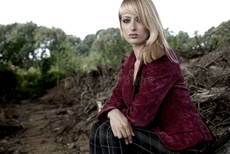 Beautiful girl sitting on the ground