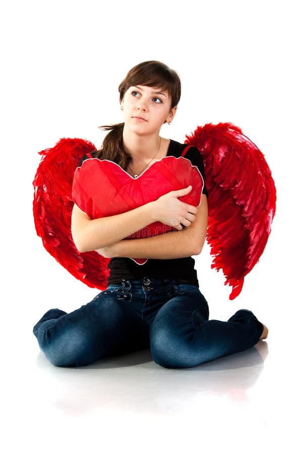 Beautiful girl sitting with heart