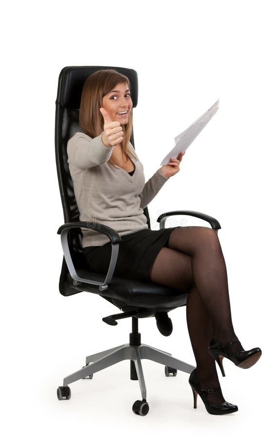 Beautiful girl is sitting in an office chair