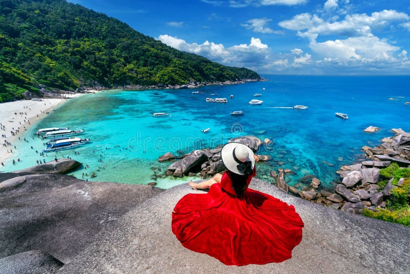 Beautiful girl sitting on the rock at Similan island, Thailand