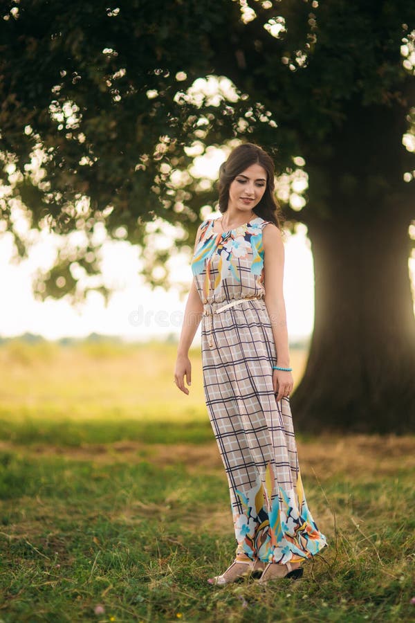 Beautiful Girl Stand Near a Large Green Tree. Love Story Stock Image ...