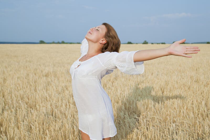 Beautiful girl standing in field