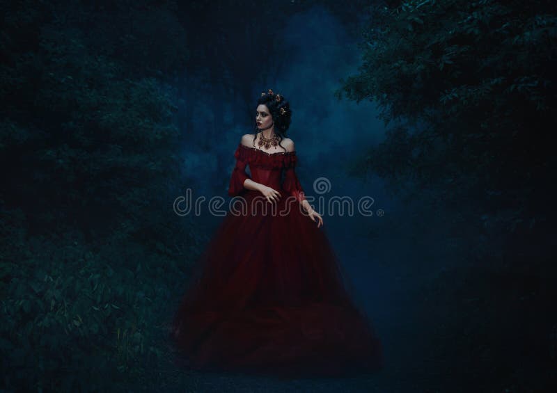 Beautiful girl standing in a red dress stock images Beautiful girl standing in a red dress stock images