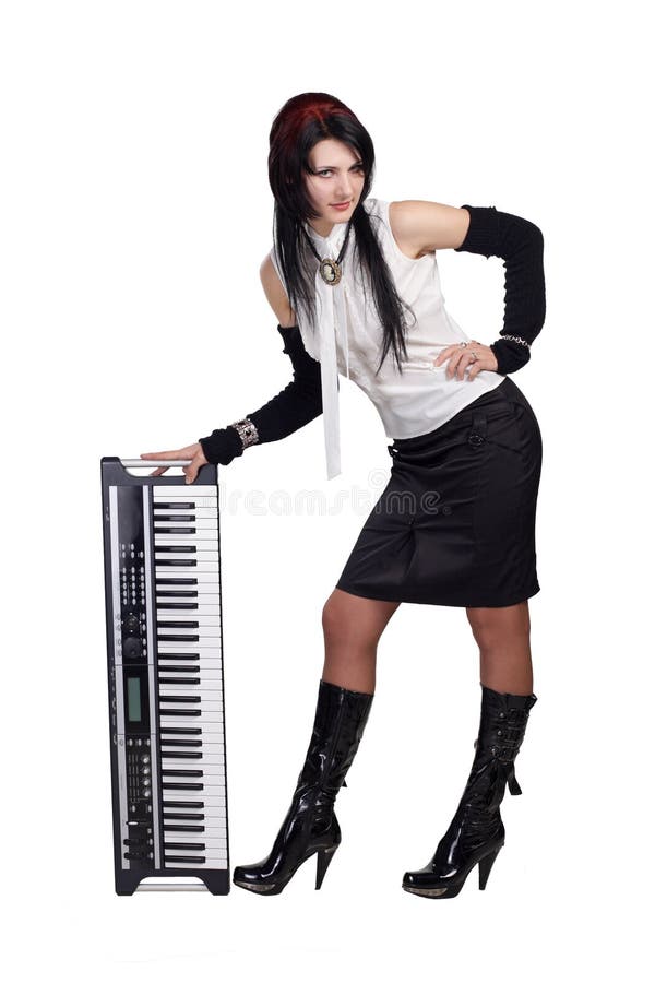 Beautiful girl staying with synthesizer isolated