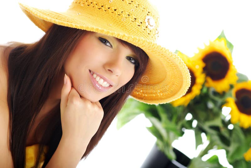 Beautiful girl with sunflowers on white background