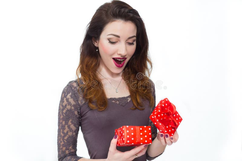 Beautiful girl taken by surprise opening gift box royalty free stock images Beautiful girl taken by surprise opening gift box royalty free stock images