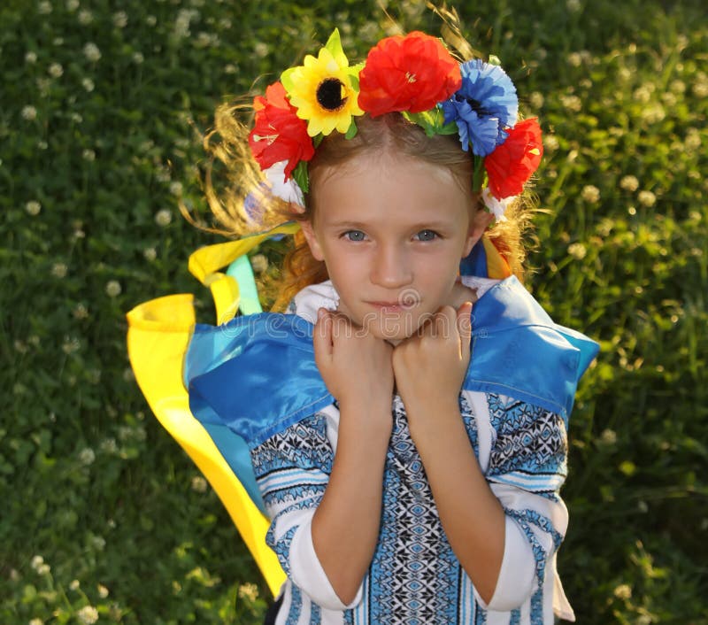 Beautiful Girl In Traditional Ukrainian Clothes Holding A Flag Of Ukraine Stock Image Image Of