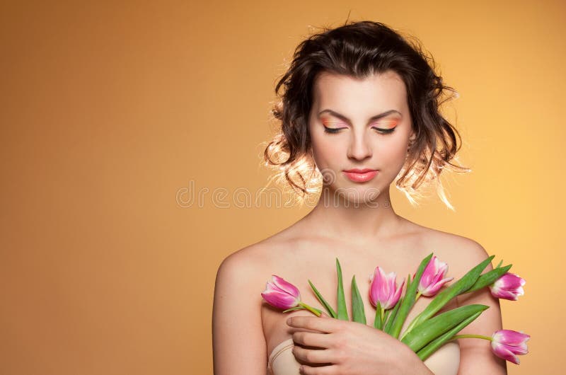 Beautiful girl with tulips