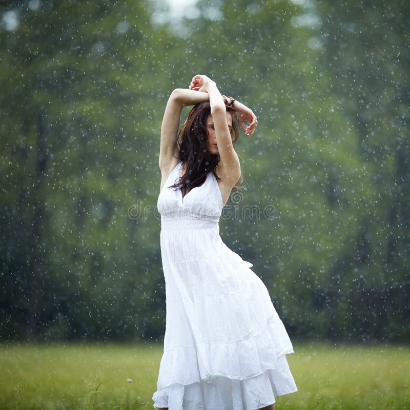 Beautiful girl under rain stock photo. Image of dress 69032708