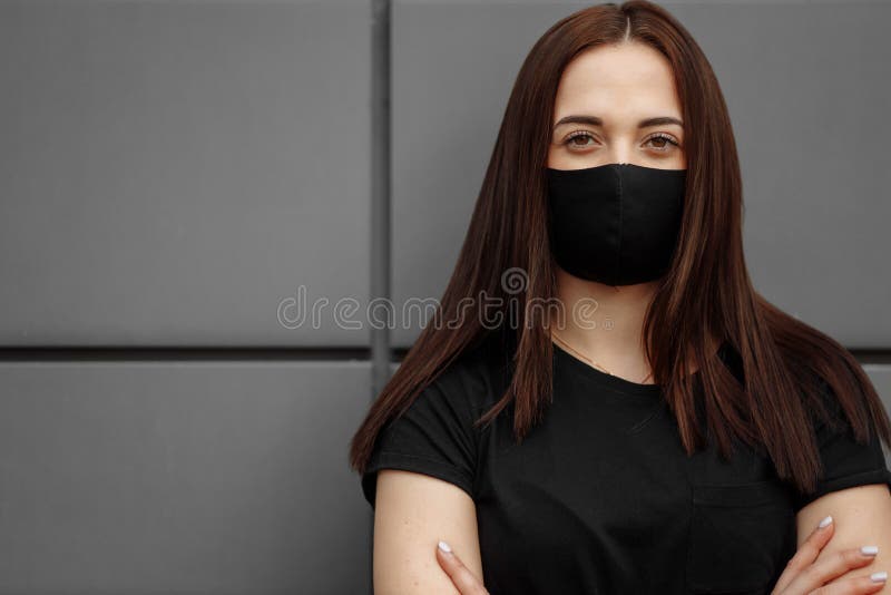 Beautiful Girl Wearing Medical Mask During Coronavirus COVID-19 Epidemic Pandemic Covid-19 coronavirus protection.