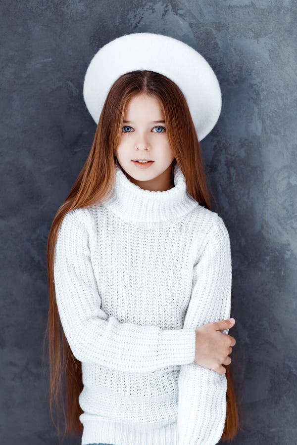 A Beautiful Girl Wearing a White Beret. a Girl in a Studio Stock Image